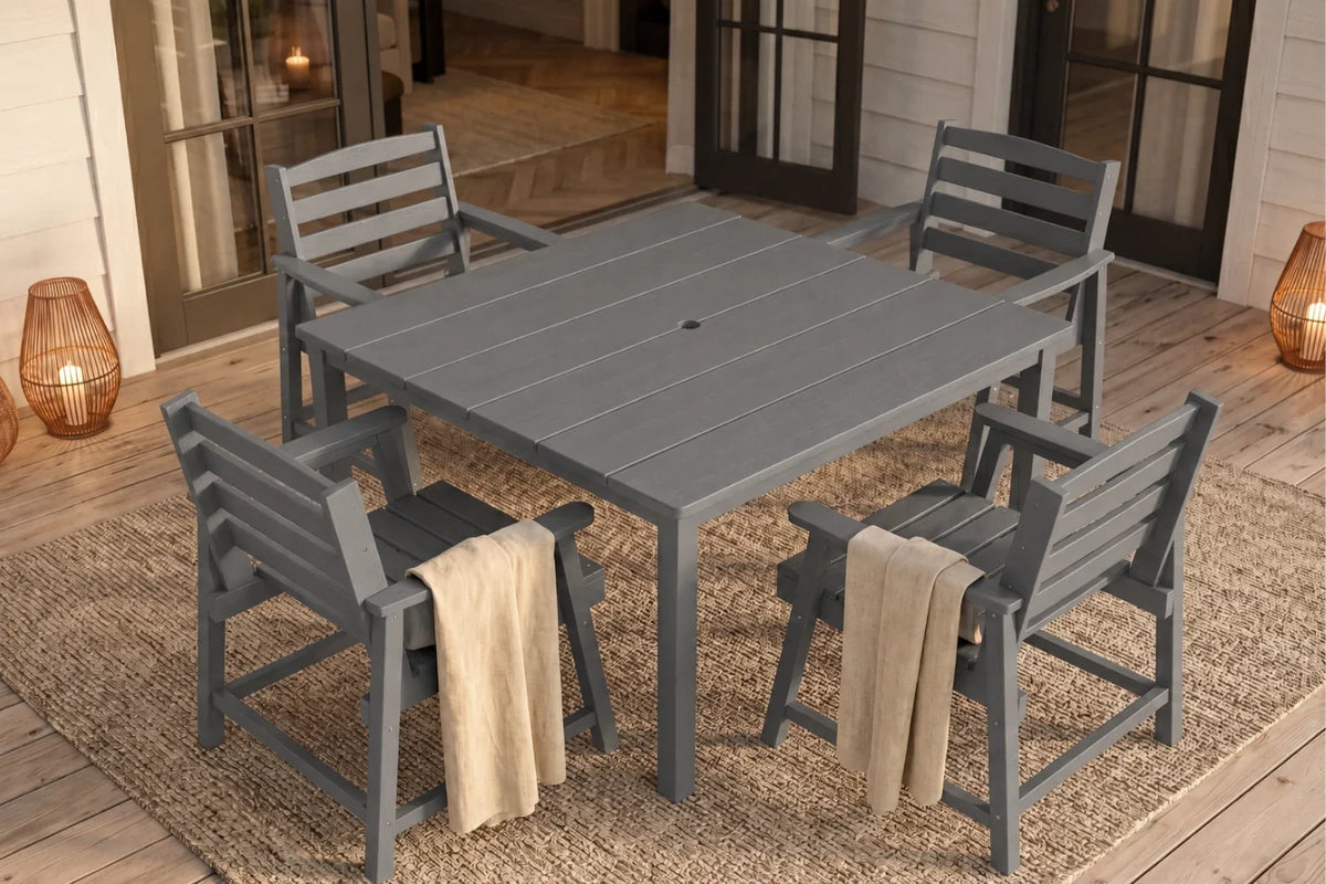 Gray Outdoor dining set with a table and chairs on a wooden deck.