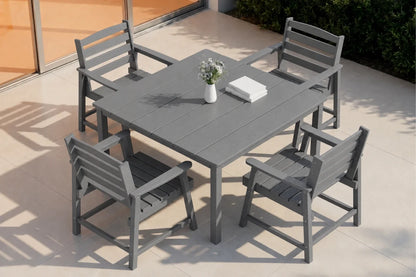 Gray outdoor dining table with four matching chairs on a patio.