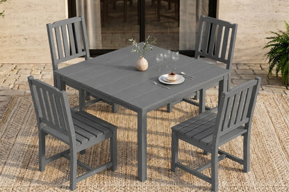 Gray outdoor dining set with table and 4 armless chairs on a patio.