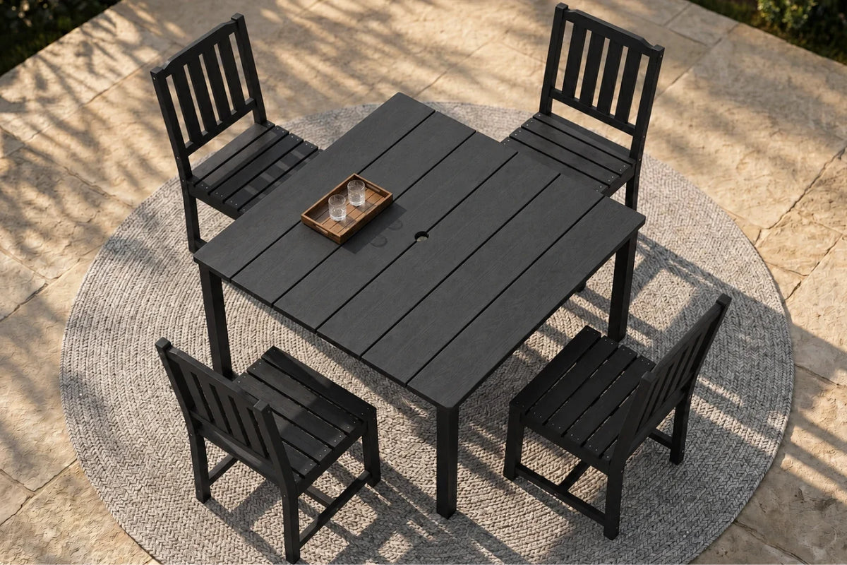 Black Outdoor dining set with a table and four armless chairs on a patio.