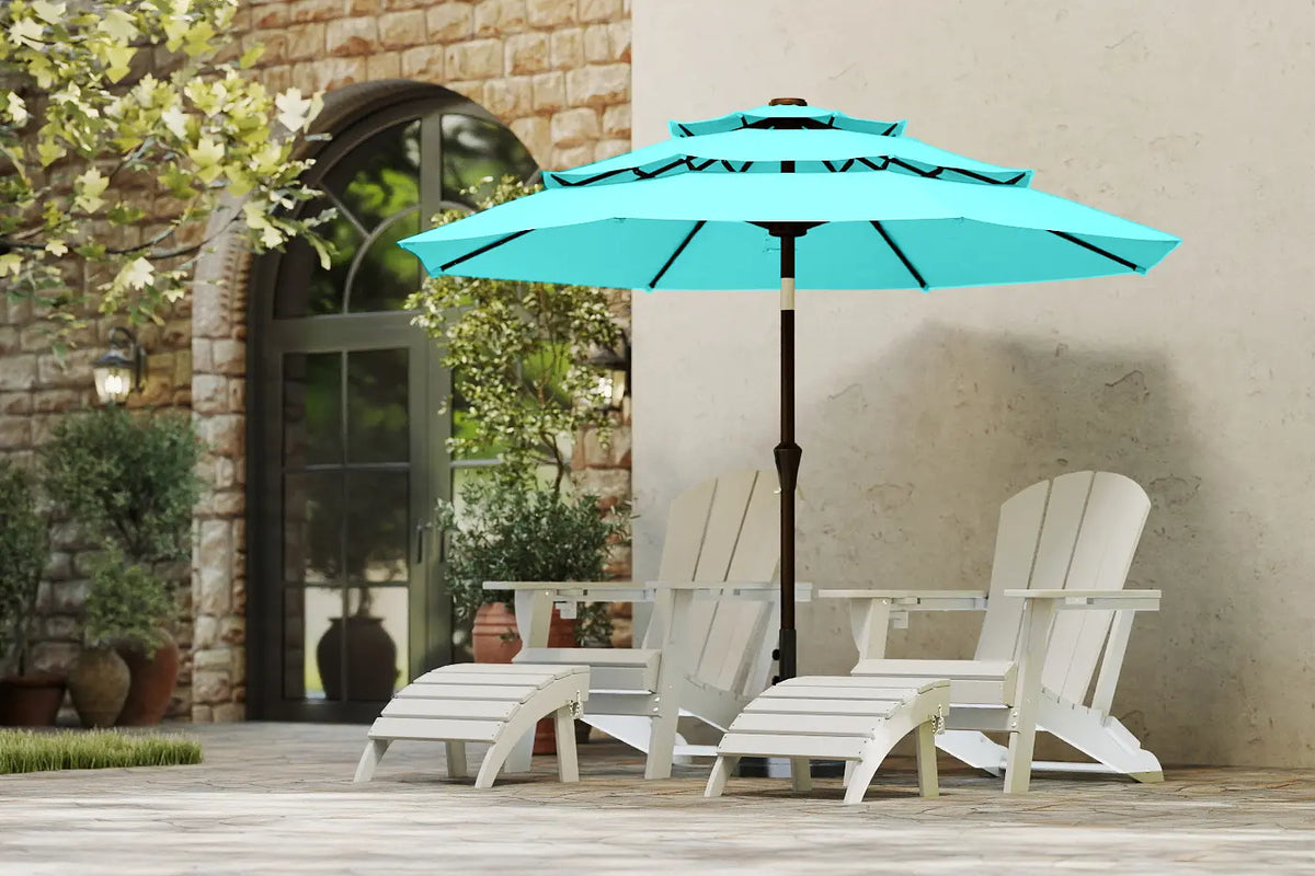 Turquoise patio umbrella over a table and chairs on a patio with a stone wall background