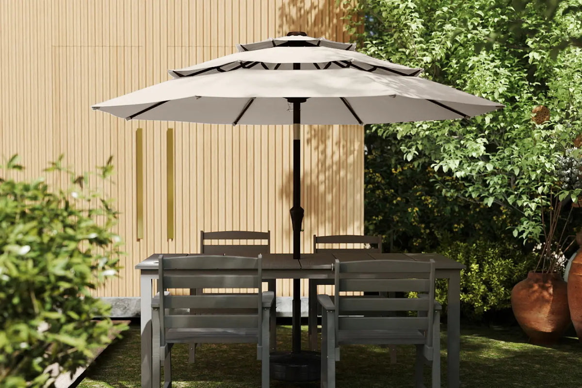 Garden table with chairs and a large umbrella in a garden setting