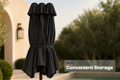 A black folded patio umbrella with a gathered, pleated design and a waist tie, shown outdoors in a garden setting with a house and pool in the background. A text overlay on the bottom right reads 'Convenient Storage'.
