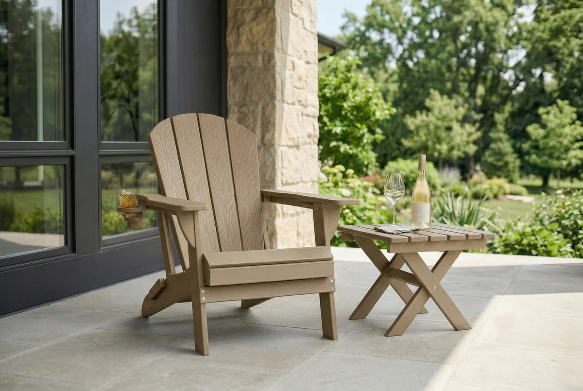HDPE Adirondack chair and small table on a patio with a view of nature.