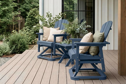 Two navy blue Adirondack chairs with cushions on a wooden deck.
