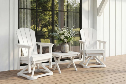 Two white chairs with a small table and flowers on a wooden deck.