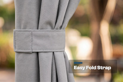 Close-up of a gray curtain tied back with a matching fabric strap, with a blurred outdoor background and an overlay label reading 'Easy Fold Strap'.