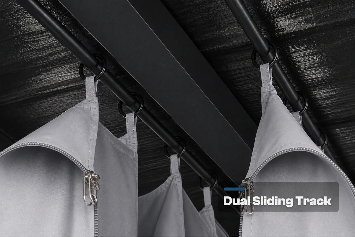 A close-up view of gray zippered hanging curtains suspended from a black dual sliding track system on a dark textured ceiling. A text overlay in the bottom right reads 'Dual Sliding Track'.