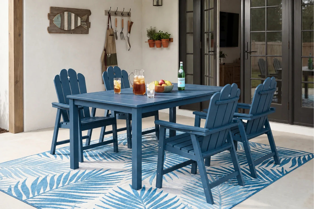 Navy blue outdoor dining set with table and 4 chairs on a patterned rug.