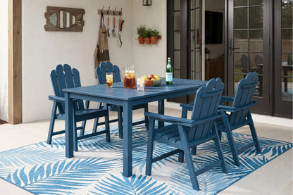 Navy blue outdoor dining set with table and 4 chairs on a patterned rug.