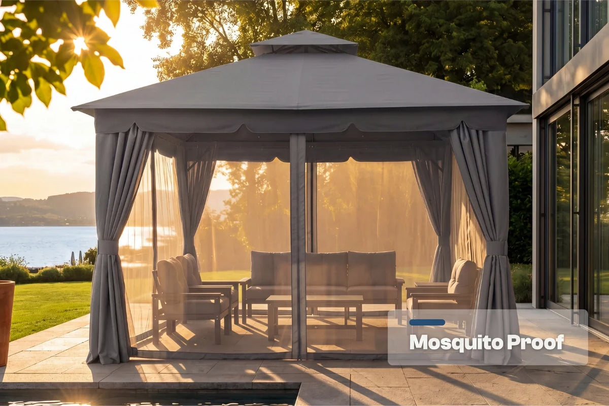 Outdoor gazebo with mosquito netting on a patio area with a scenic background