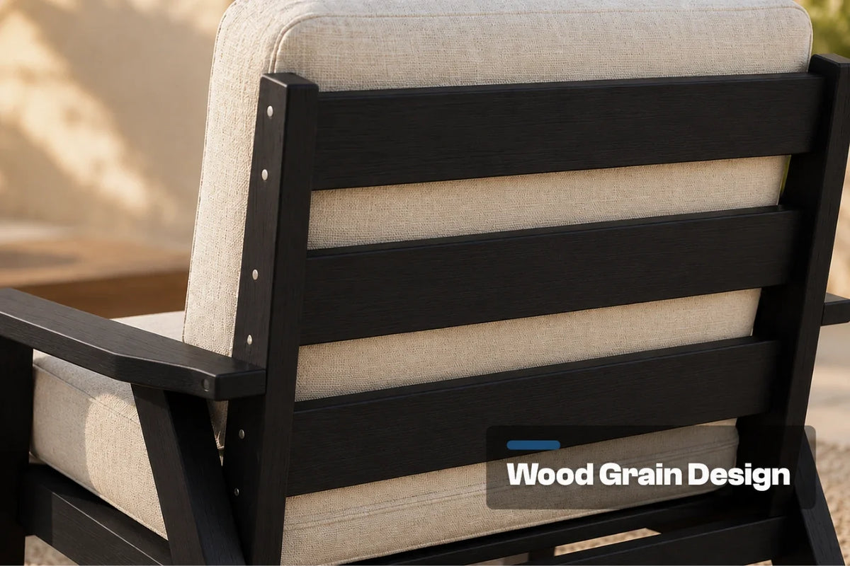Close-up of the back of an outdoor patio chair with a black wood-look slatted frame and creamy white textured cushions. A text overlay reads 'Wood Grain Design'.