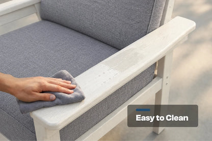 A close-up of a hand wiping down a creamy white armrest of a gray upholstered outdoor chair with a gray cloth. A dark gray badge in the lower right corner reads 'Easy to Clean'.